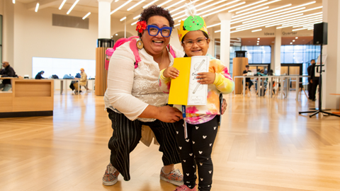Image shows a family at State Library Victoria